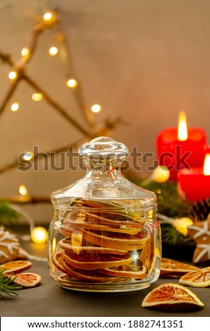 dried oranges in a glass jar. Homemade dried oranges slices in the jar. Christmas