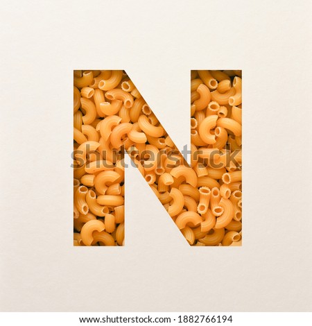 Font design, Abstract alphabet font with elbow macaroni, realistic food typography - N Royalty-Free Stock Photo #1882766194
