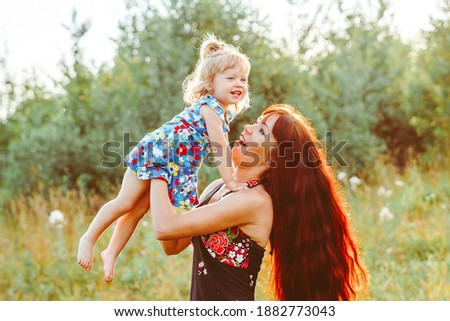 mother holds baby in her arms