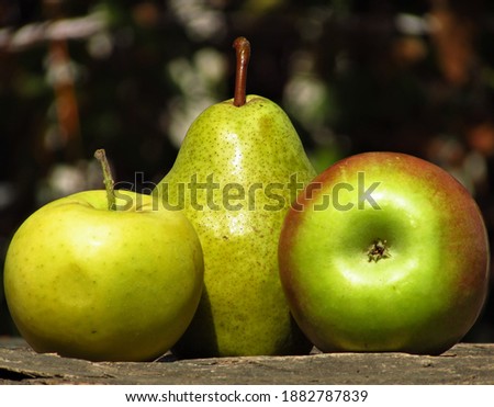 pears and apples on a board, macro