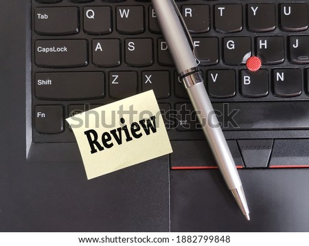 Customer Experience Concept. Review Written On Sticky Note With Pen and Laptop Concept