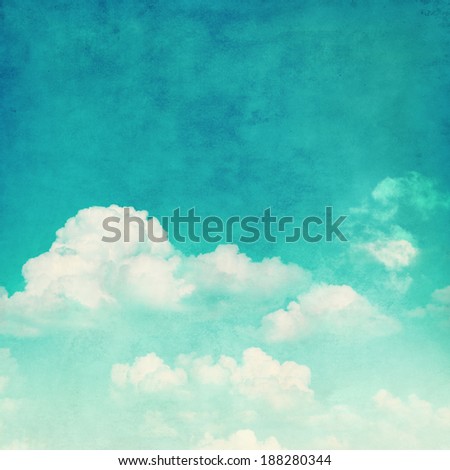 Blue sky with white clouds in grunge style.