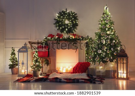 Beautiful Christmas themed photo zone with fireplace and fir decor