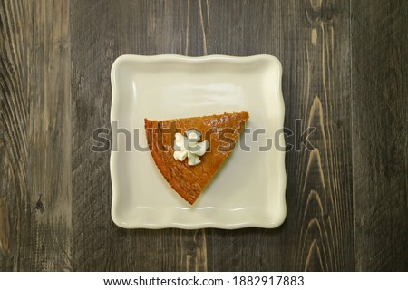Top view of a slice of crustless pumpkin pie.