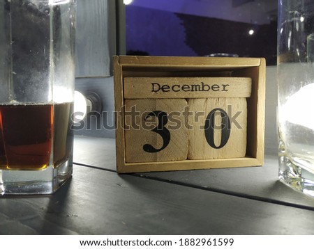 The wooden calendar shows December 30th.