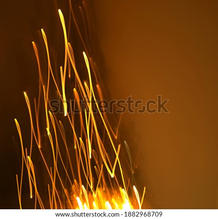 abstract golden lines in the form of a christmas tree on a dark background