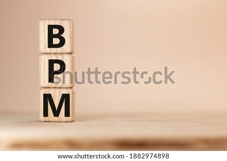 Word BPM Business Process Management on wooden block Royalty-Free Stock Photo #1882974898
