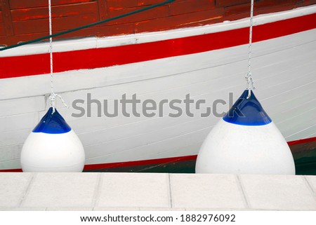 Details of boat side with protection fender sailing boating background with space for text and graphics