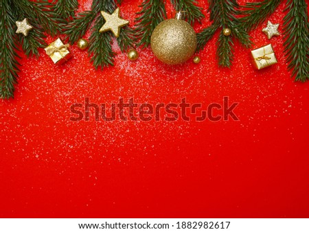 Christmas background in red and gold with fir branch