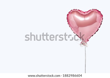 Pink air balloons heart shape on a white background. Concept wedding, valentines day, photo zone, lovers. Banner. Flat lay, top view Royalty-Free Stock Photo #1882986604