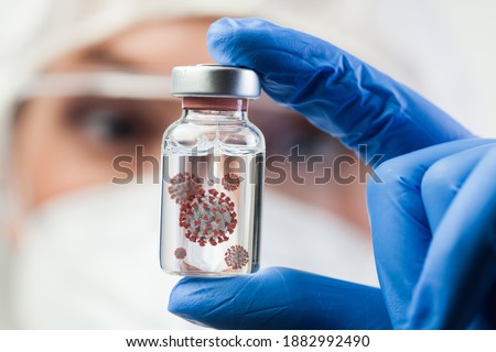 Female UK lab scientist doctor holding glass ampoule dish containing Coronavirus molecule cell,new IHU virus strain,COVID-19 RNA mutation change,conceptual visualization,cure research illustration  Royalty-Free Stock Photo #1882992490
