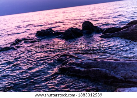 lake garda salo beautiful colorful sunrise with rocks. High quality photo