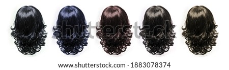 Hair. Artificial hair. Wig on white background Royalty-Free Stock Photo #1883078374