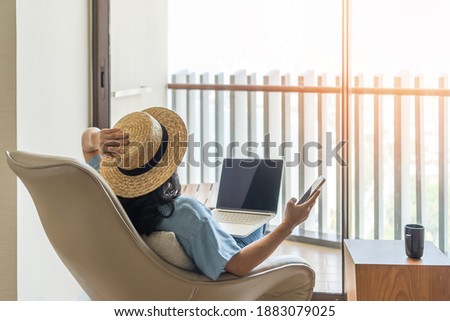 Life-work balance, relaxation healthy quality living lifestyle in summer holiday vacation of freelancer woman take it easy resting in resort hotel balcony having peace of mind  Royalty-Free Stock Photo #1883079025