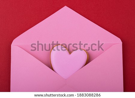 open pink envelope with pink hearts on a red background. Valentine's day, mother's day