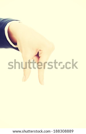 Woman's hand showing copy space between fingers. Isolated on white.