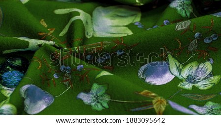 Cotton, green background with a print of bunnies and fruits. The jersey fabric is so named because it was first produced in the Middle Ages on the Channel Island of Jersey.