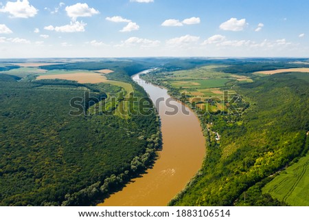 Winding canyon of the Dniester River from a bird's eye view. Location place Dnister canyon of Ukraine, Europe. Aerial photography, drone shot. Photo wallpaper. Discover the beauty of earth.