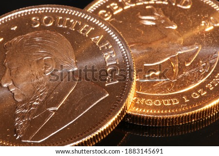 Close up of two Krugerrand gold coins