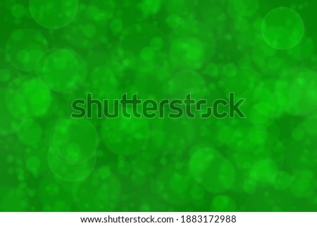 Deep vivid green colored abstract background bokeh.