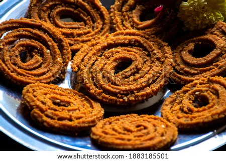Picture of traditional festival snacks of India Chakali, Popular homemade salty and spicy snacks.