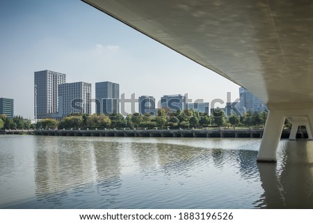Modern city by the river and bridge