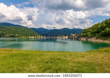 Sunny summer day on artificial Zaovine lake on Tara Mountain, Serbia. Royalty-Free Stock Photo #1883206075