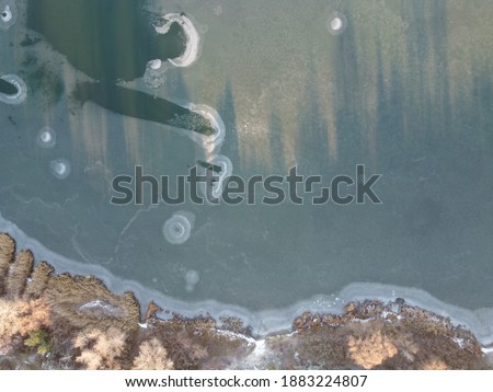 winter landscape from a height. frosty air and ice on the river. river in winter from above