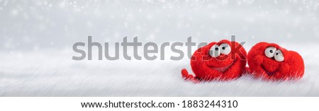 Two toy red hearts on white fur background with copy space for text, symbol of love, healtcare, valentines day concept