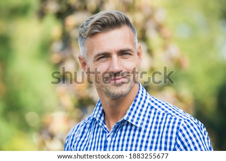express positive human emotions. mature unshaven man shirt. male fall season fashion. handsome smiling guy outdoor. male hair beauty and care. barbershop salon. facial care concept. Royalty-Free Stock Photo #1883255677
