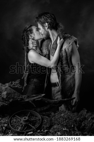 Stay safe. Loving couple hugging tightly while saying goodbye.The image on the theme of the apocalypse. Black and white.