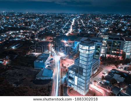 photo of light trails south Tangerang City, Banten province at night using a drone, taking pictures of the mayor's office of south tangerang with the background of the highway Pamulang 2
