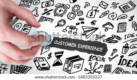 Technology, Internet and network concept. Young businessman shows the word: Customer experience 