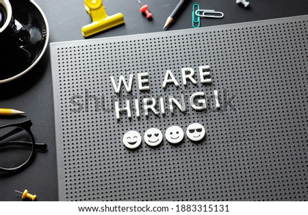 We are hiring text on desk.business team.job interview.top view 