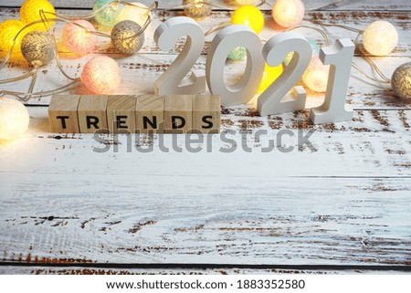 Trends 2021 word alphabet letters on wooden background