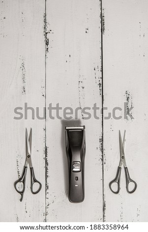 composition with hairdressing tools on a worn white wooden background. Template for a postcard or information about a hair salon. flat lay, copy space
