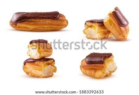 Set traditional french eclairs with chocolate isolated on white background. Clipping Path. Full depth of field. Royalty-Free Stock Photo #1883392633