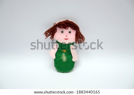 Hand crafted girl doll on white background