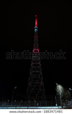 Glowing TV tower in Perm multicolored LED lighting. Architectural lighting. Wide display from the ground. Television and towers. Festival