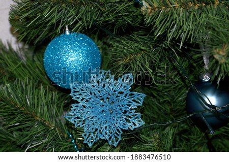 Christmas tree with blue toys.
