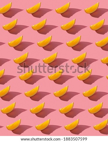 
orange slice pattern on a pink background with hard light