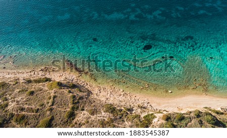 Top view aerial image from drone of an stunning beautiful sea landscape beach with turquoise water with copy space for your text.Beautiful Sand beach with turquoise water. Cesme Izmir Turkey
