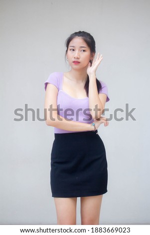portrait of thai adult office girl listen
