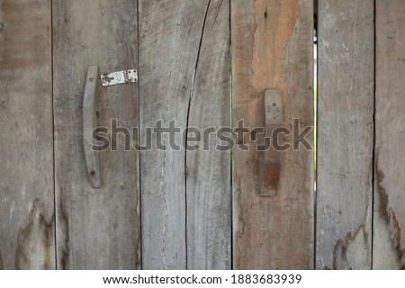 Old brown wooden door vintage style image for abstract wood texture background.
