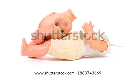 Broken old doll, isolated on white background Royalty-Free Stock Photo #1883743669