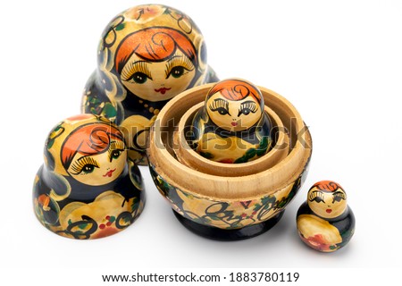 Traditional Russian doll on white isolated background Royalty-Free Stock Photo #1883780119