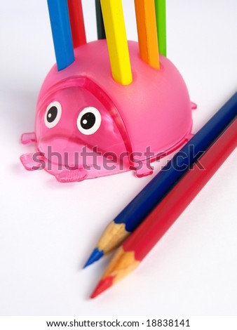 Pink Ladybug Pencil Holder, with pencils on white background
