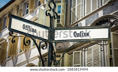 Street Sign the Direction Way to Online versus Offline