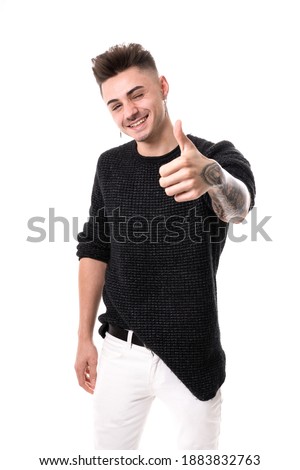Man looking at camera with thumb up and smiling, white background