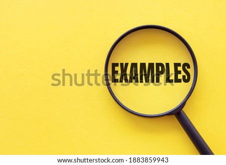 The word EXAMPLE is written on a magnifying glass on a yellow background. Royalty-Free Stock Photo #1883859943